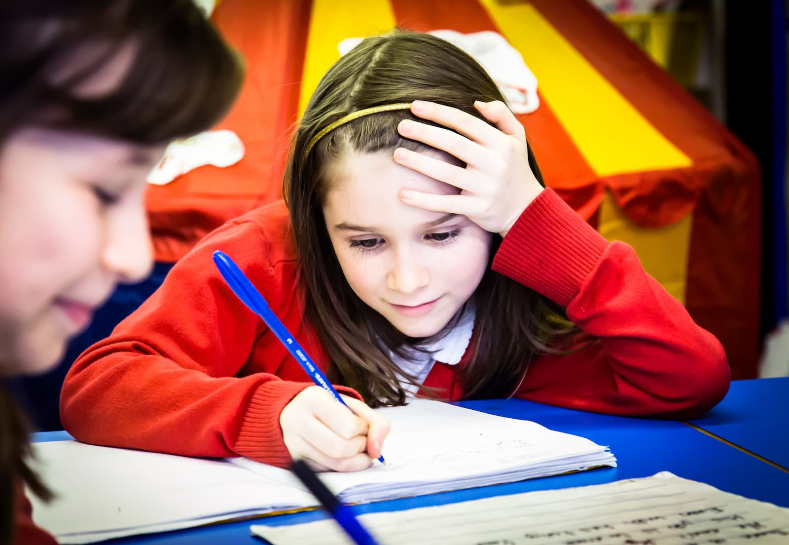 Girl writing in a notebook