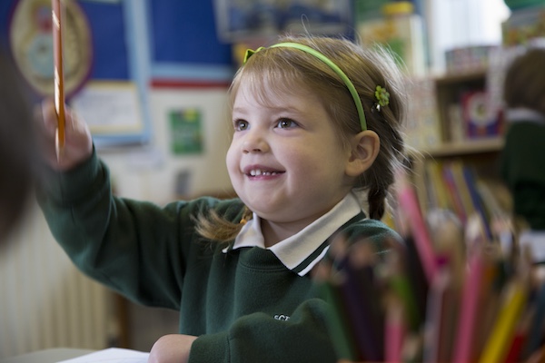 Girl with her hand raised
